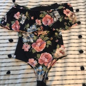 Black off the shoulder bodysuit with flowers
